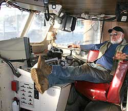 Bruce Gibbs, in the wheelhouse of the Atlantic Queen.