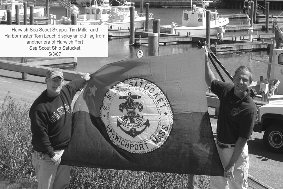 Sea Scout Ship Skipper Tim Millar and Harbormaster Tom Leach with old flag
